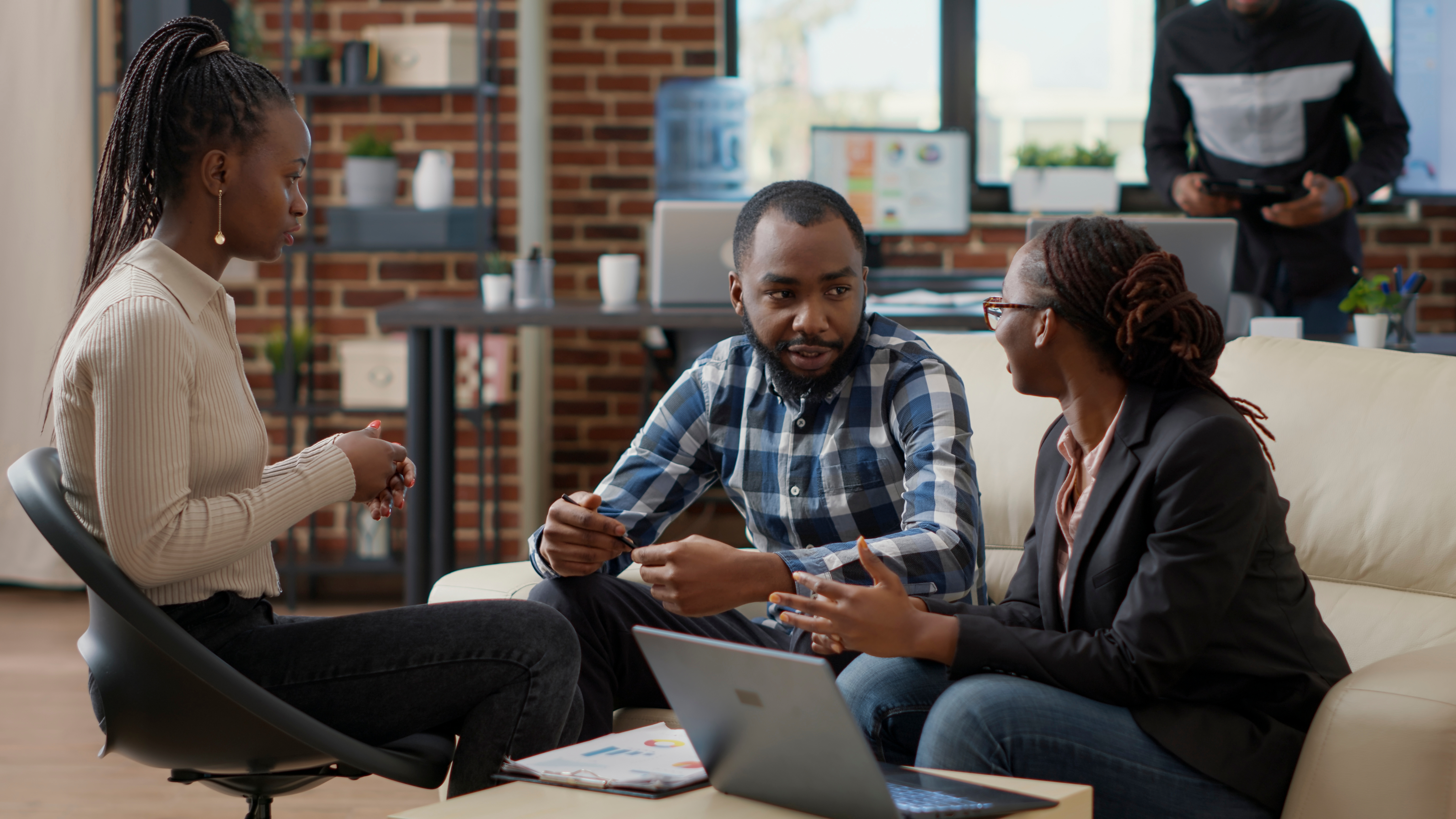 A team of business people collaborating and planning on a financial strategy